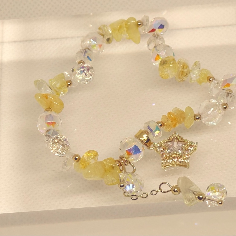 Elegant Yellow and Gold Star Charm Bracelet